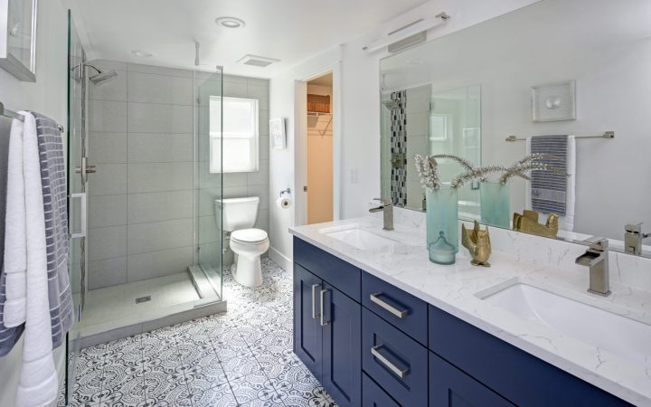 modern bathroom interior with double blue vanity and shower area